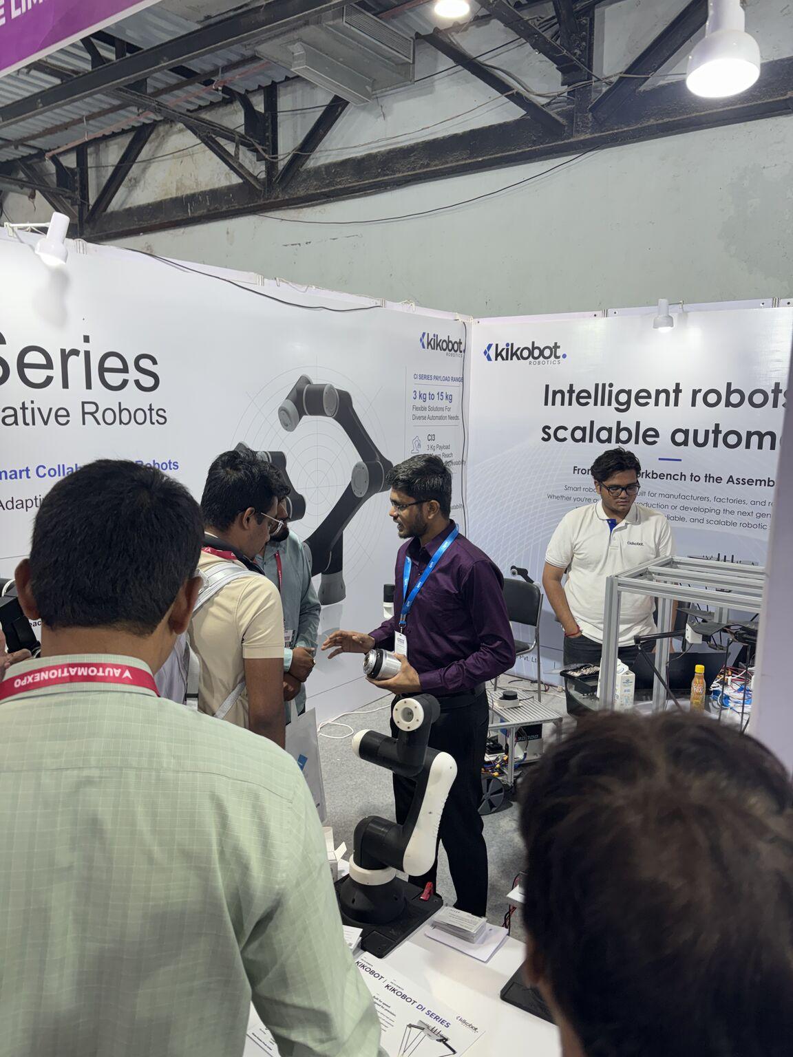 Visitors and Kikobot robots at the Automation Expo booth